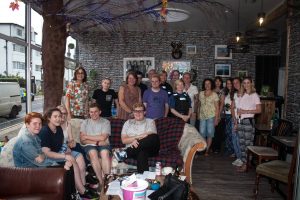 Group shot of around 25 Transpire members at Meet and Eat